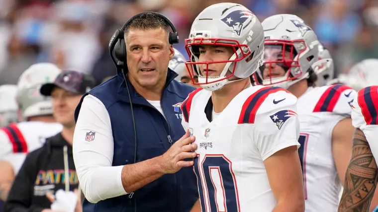 Mike Vrabel and Drake Maye Mike Vrabel talks to quarterback Drake Maye